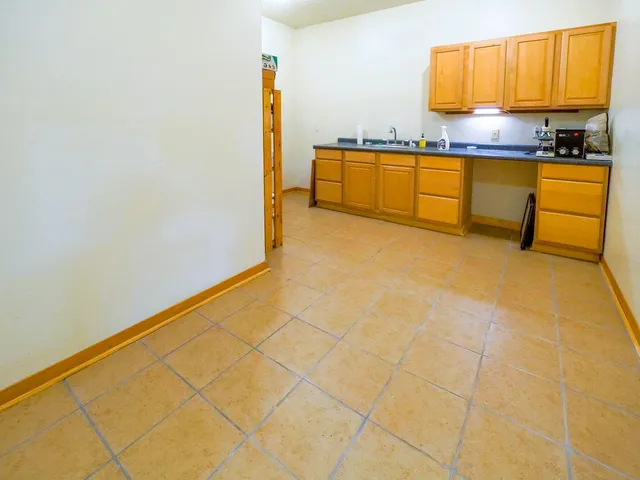 a bed room with a bed and a book shelf