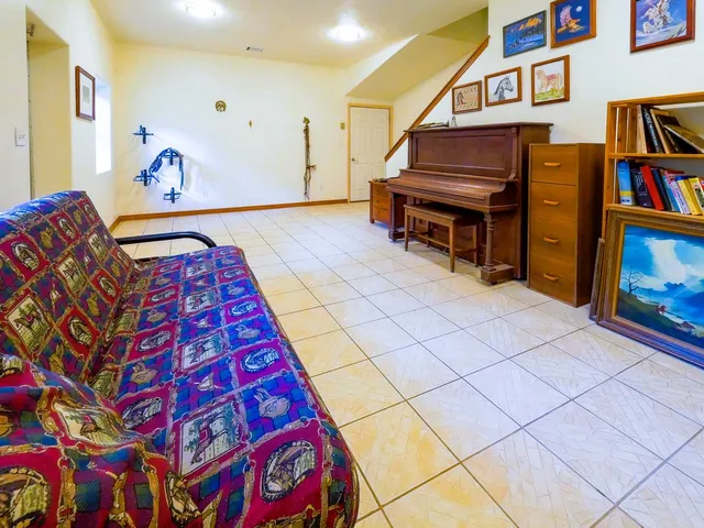a living room with furniture and a kitchen view