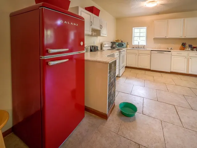 a bedroom with a bed and a table in it