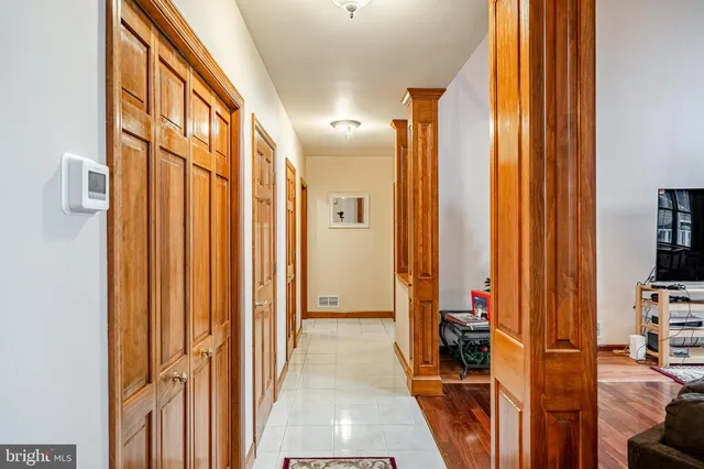 a view of a hallway with a large window and stairs
