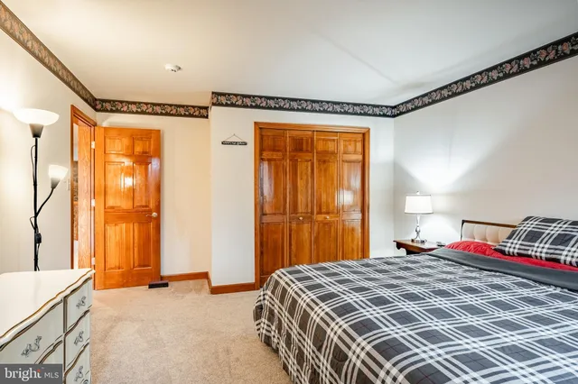 a bathroom with a sink double vanity and a toilet