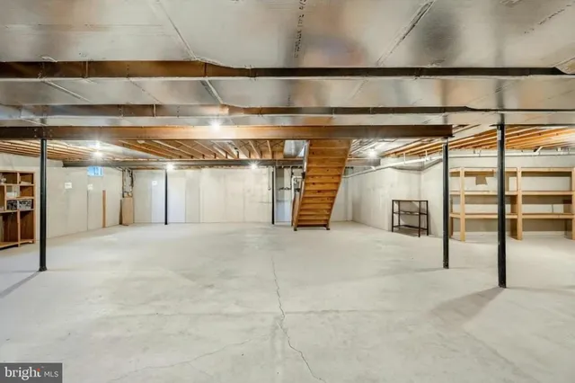 a view of a chairs on deck and floor to ceiling window