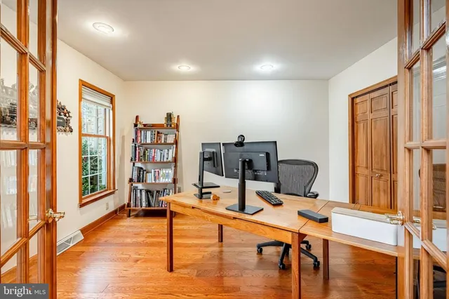 a work room with furniture and wooden floor