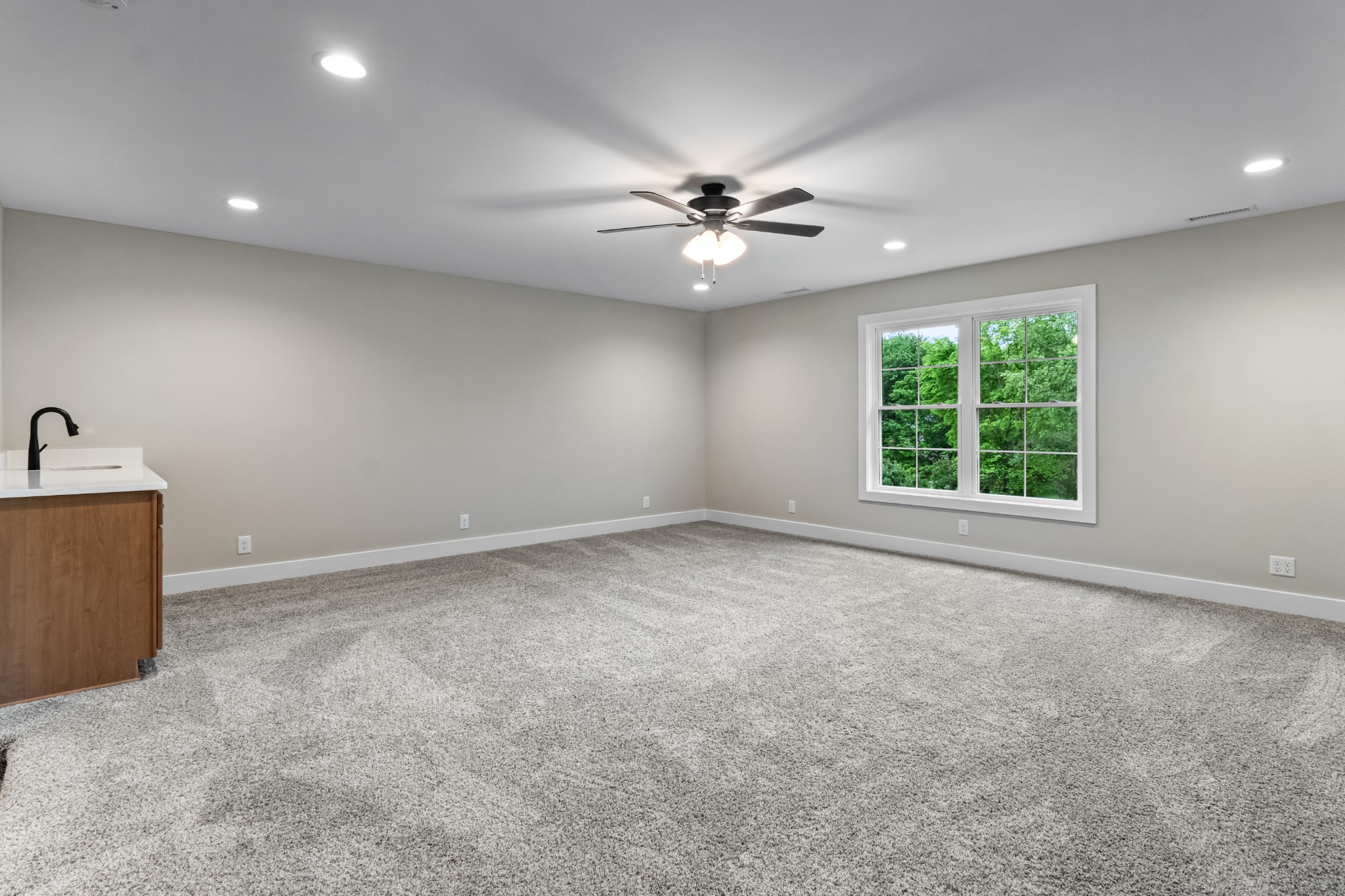 3600 Trough Springs Road Adams, TN 37010 - Photo 40 of 54 an empty room with windows and ceiling fan