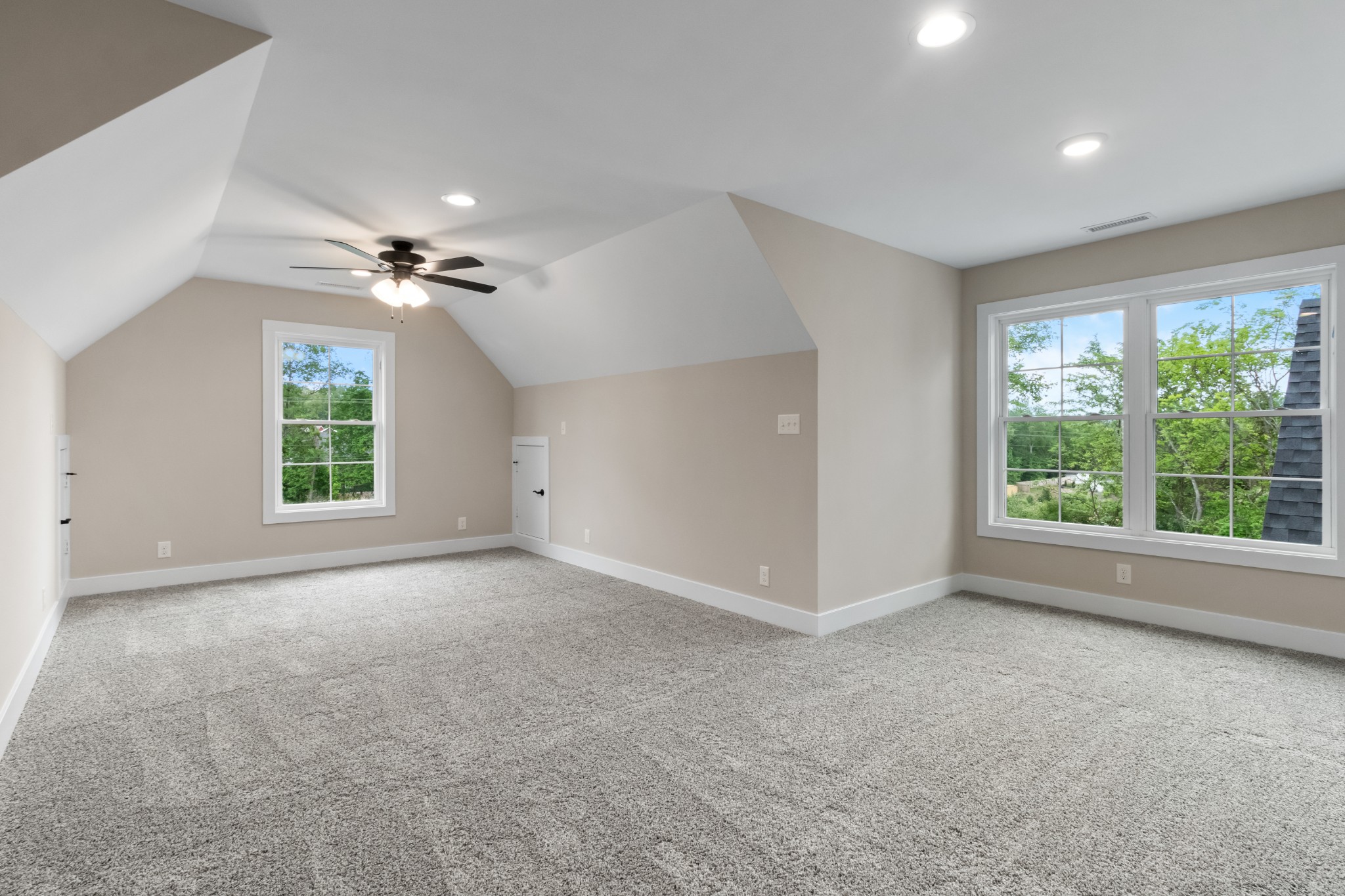 3600 Trough Springs Road Adams, TN 37010 - Photo 46 of 54 an empty room with windows and chandelier fan