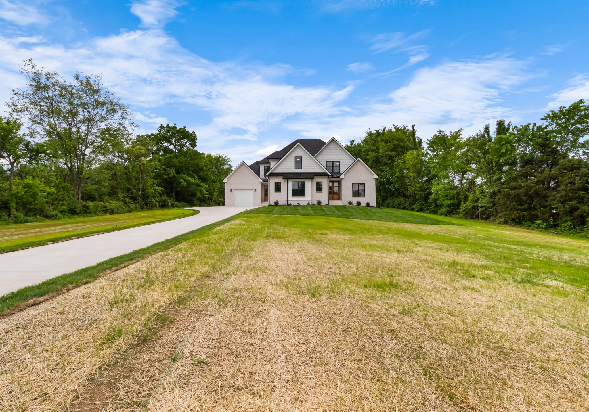 3600 Trough Springs Road Adams, TN 37010 - Photo 6 of 54 a view of a large garden with a house in the background