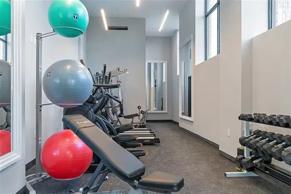 a room with a mirror and gym equipment