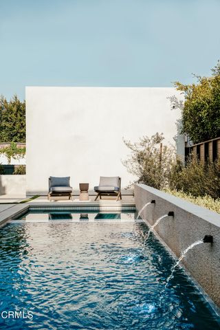 a spacious bathroom with a tub shower and sink