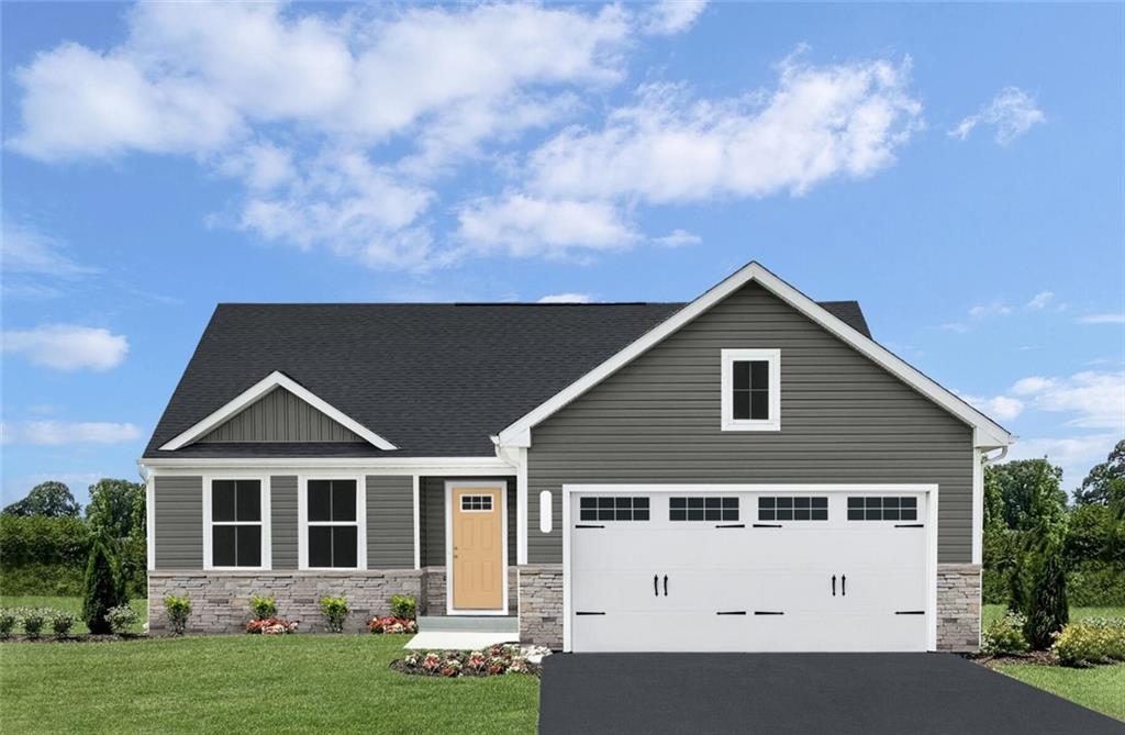 a view of a house with yard and tree s