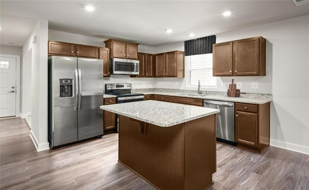 101 Walk Off Way Butler, PA 16001 - Photo 3 of 11 a kitchen with stainless steel appliances granite countertop a sink stove and refrigerator