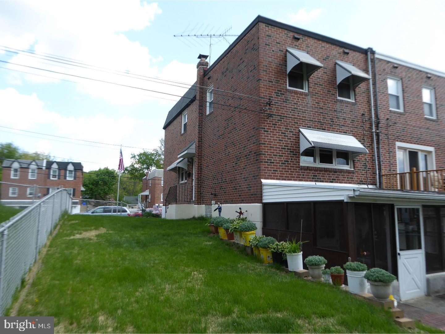 11926 Stevens Road Philadelphia, PA 19116 - Photo 14 of 25 a front view of a house with a garden and plants