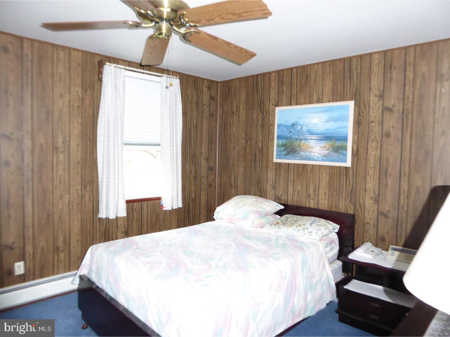 11926 Stevens Road Philadelphia, PA 19116 - Photo 22 of 25 a bedroom with a bed and a window