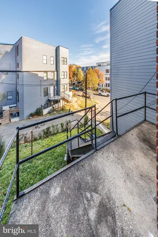 a view of a bench in front of a building