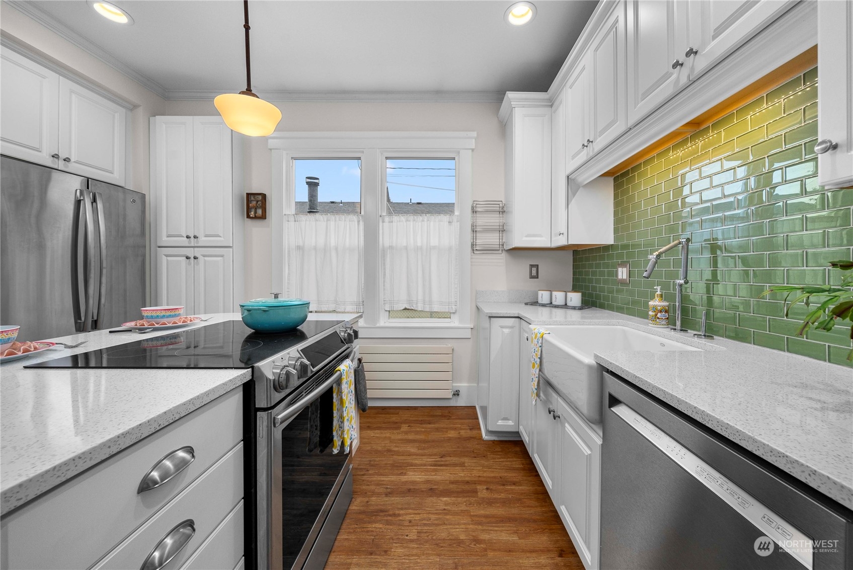 2510 Rockefeller Avenue Everett, WA 98201 - Photo 11 of 40 a kitchen with a sink stove and cabinets