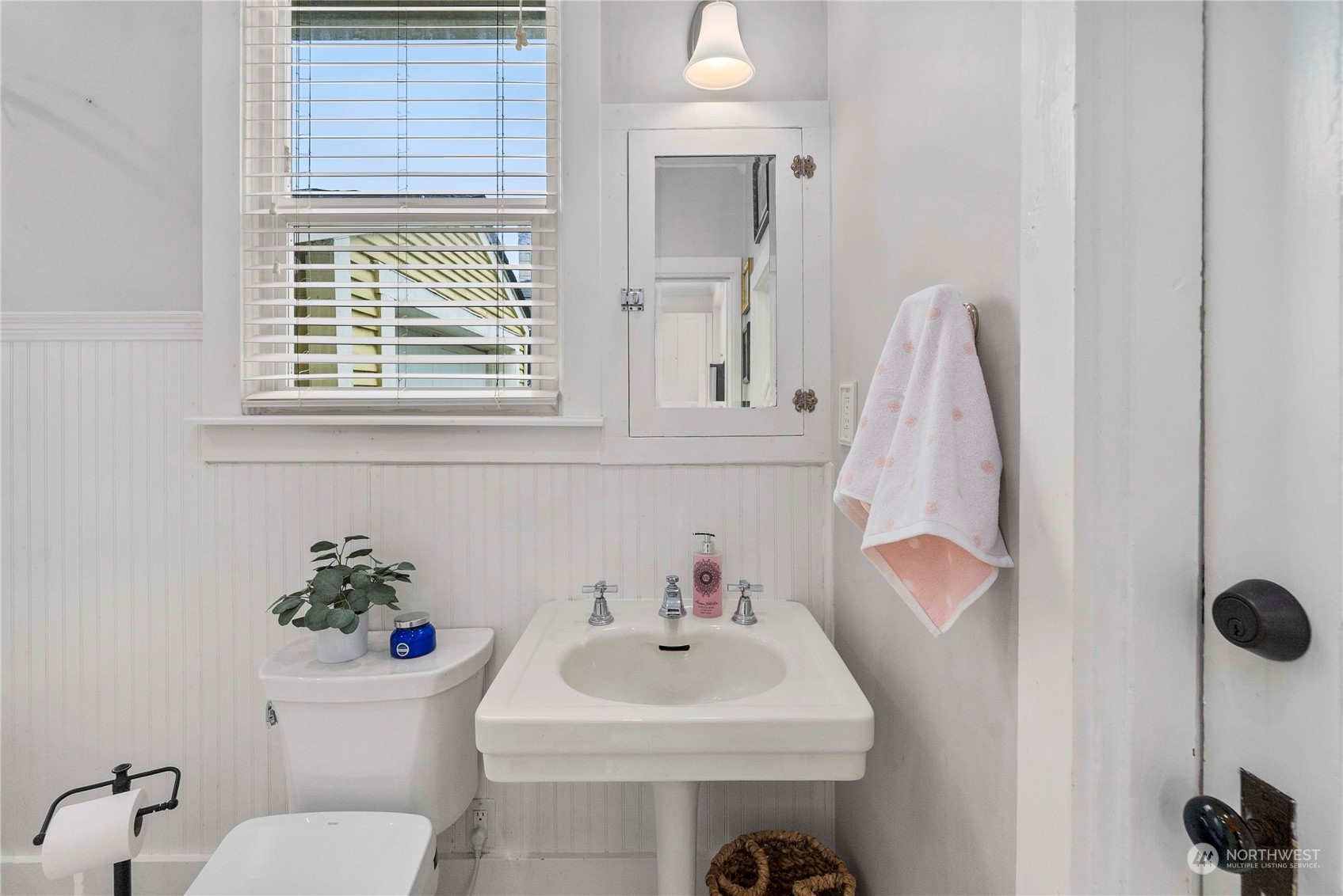 2510 Rockefeller Avenue Everett, WA 98201 - Photo 15 of 40 a bathroom with a sink a toilet and a window