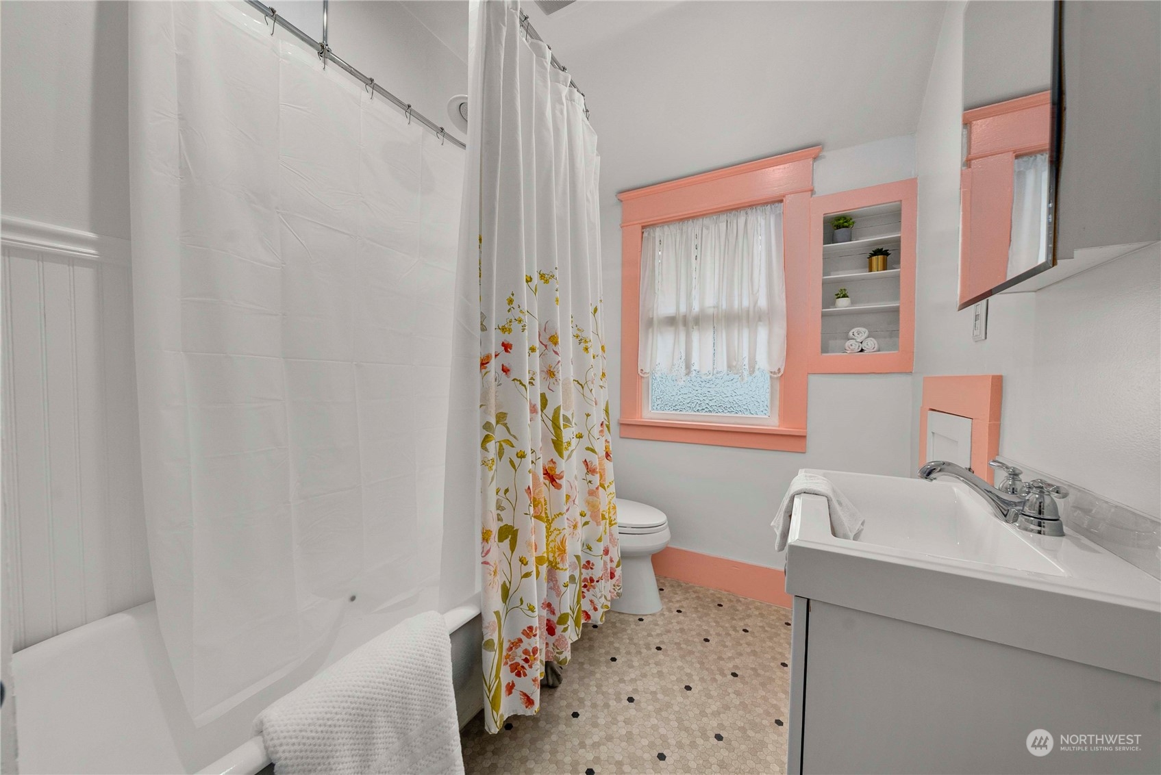 2510 Rockefeller Avenue Everett, WA 98201 - Photo 24 of 40 a bathroom with a sink a toilet and a shower curtain
