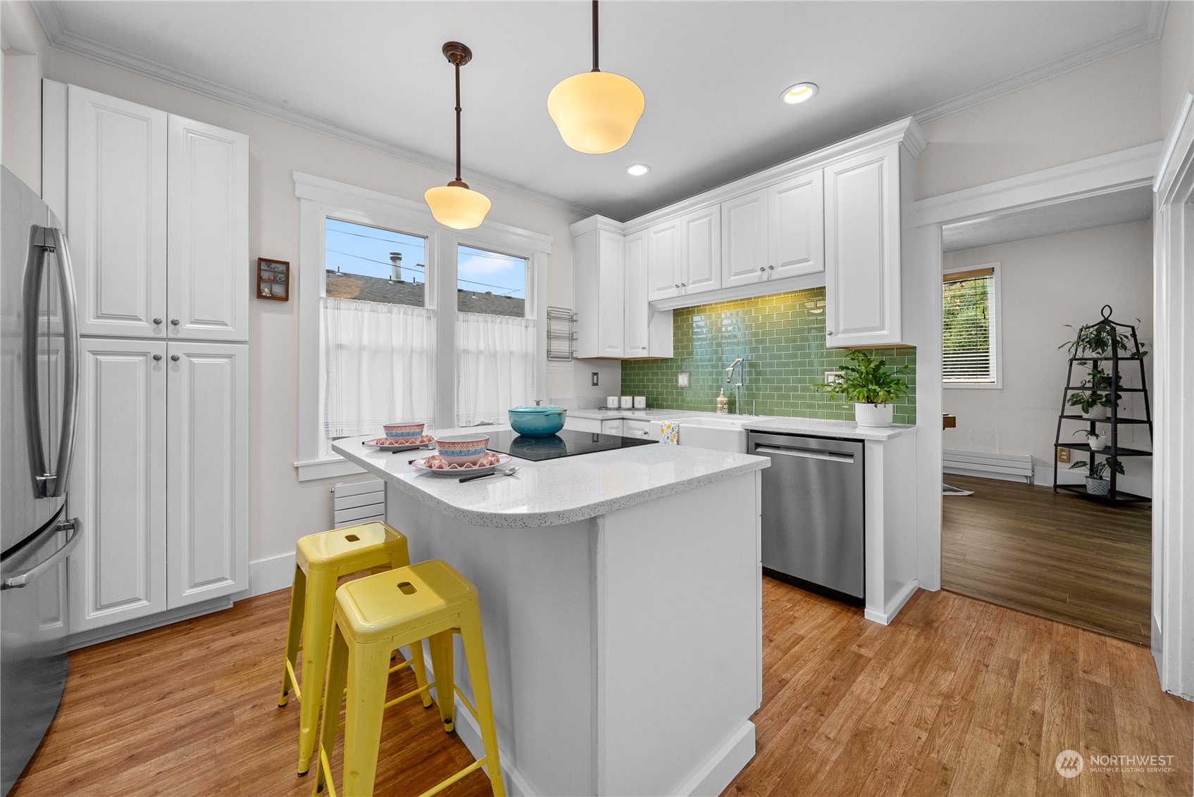 2510 Rockefeller Avenue Everett, WA 98201 - Photo 9 of 40 a kitchen with stainless steel appliances granite countertop a sink a stove and a wooden floors