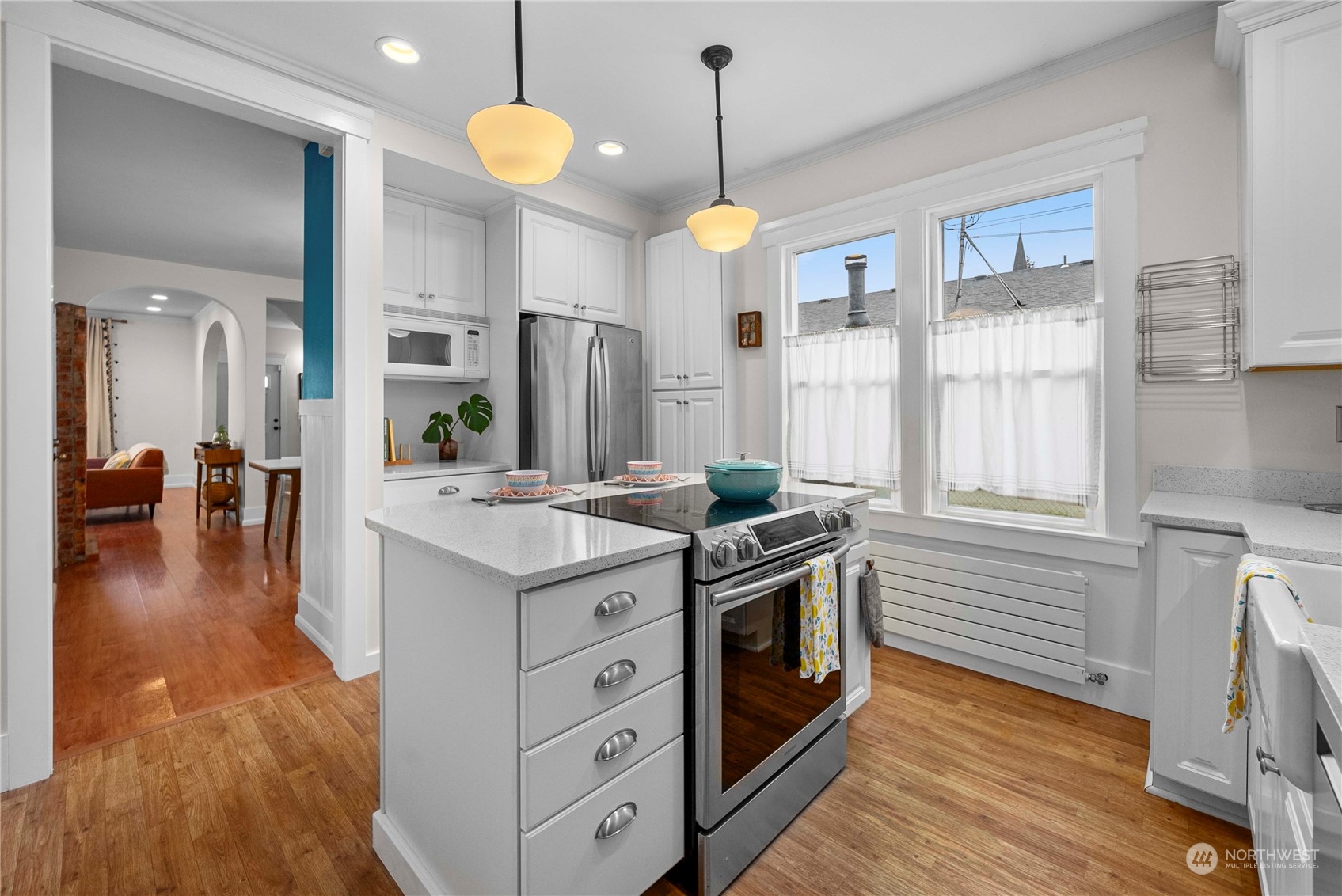 2510 Rockefeller Avenue Everett, WA 98201 - Photo 10 of 40 a kitchen with stainless steel appliances granite countertop a stove and a wooden floors