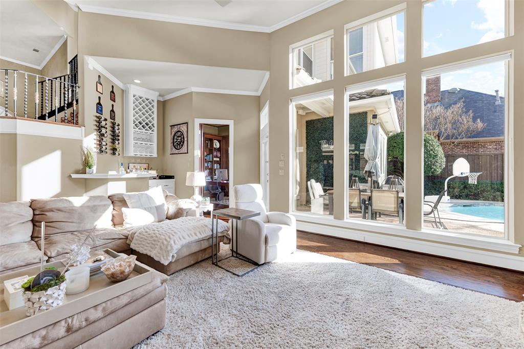 2605 Rutgers Court Plano, TX 75093 - Photo 11 of 34 You'll fall in love with the family room! Not only is there soft plush carpeting, but you have stunning views of the pool and patio through three floor-to-ceiling sets of windows.
