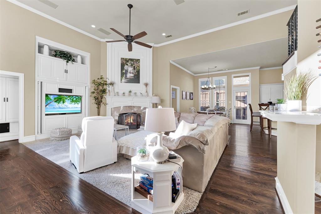 2605 Rutgers Court Plano, TX 75093 - Photo 12 of 34 A built-in entertainment center provides lots of storage space for games, DVDs, etc. There's even more storage in the short hallway to the half bath! There is plenty of opportunity still this year to enjoy the gas log fireplace!