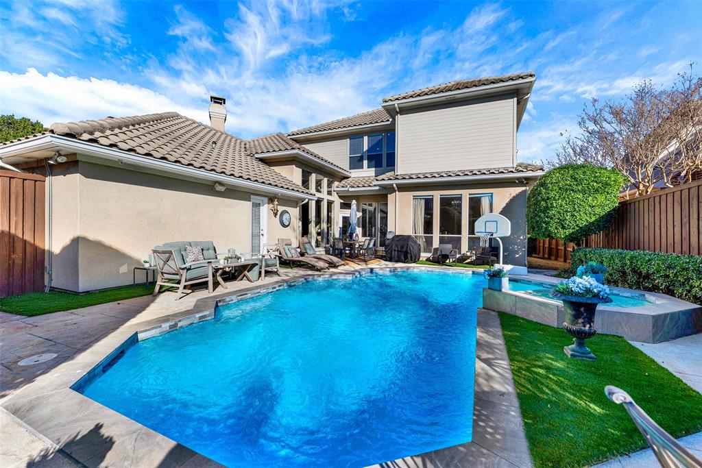 2605 Rutgers Court Plano, TX 75093 - Photo 28 of 34 The sparkling pool and spa are surrounded by artificial turf installed in 2026! No mowing, weeding, fertilizing, etc! Just relax and enjoy.