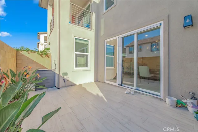 front view of a house with a potted plant