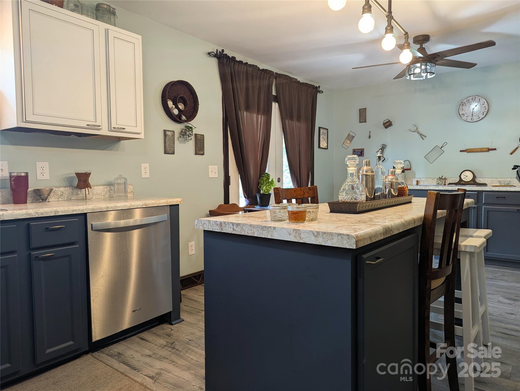 3080 Shue Road Salisbury, NC 28147 - Photo 24 of 38 a kitchen with stainless steel appliances granite countertop a sink a stove and a wooden floors