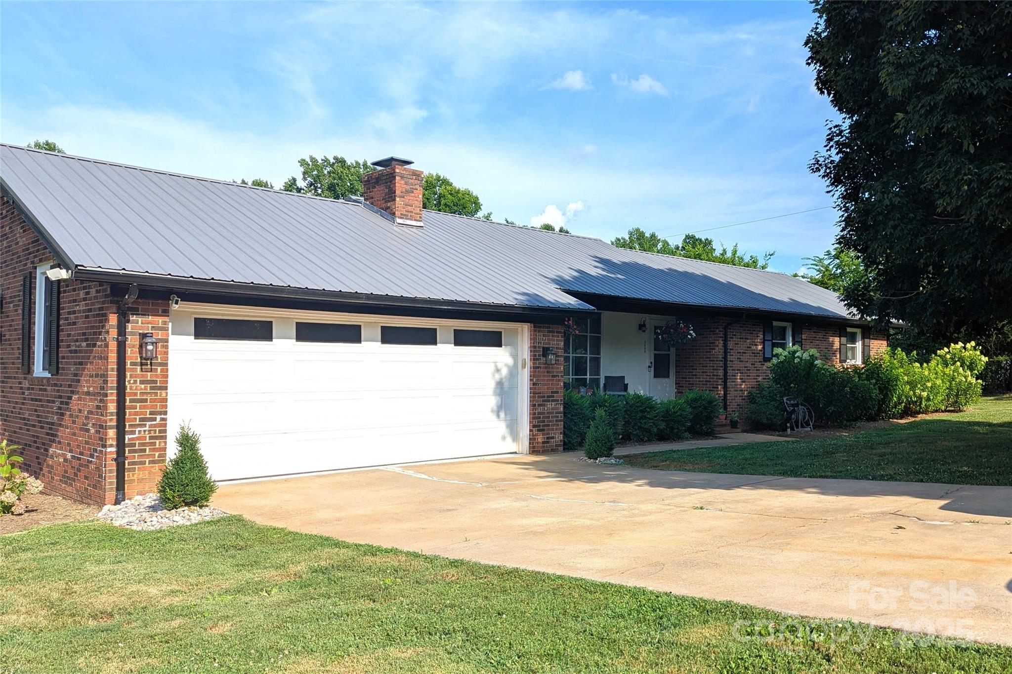 3080 Shue Road Salisbury, NC 28147 - Photo 3 of 38 a front view of a house with a yard and garage