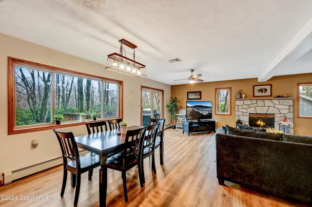 a kitchen with stainless steel appliances granite countertop a refrigerator a stove and a sink