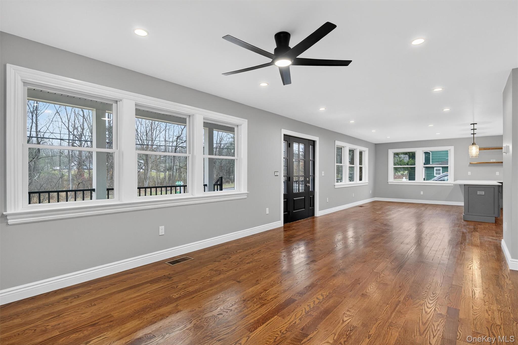 3 Little York Road Warwick, NY 10990 - Photo 18 of 39 a view of a big room with wooden floor and windows