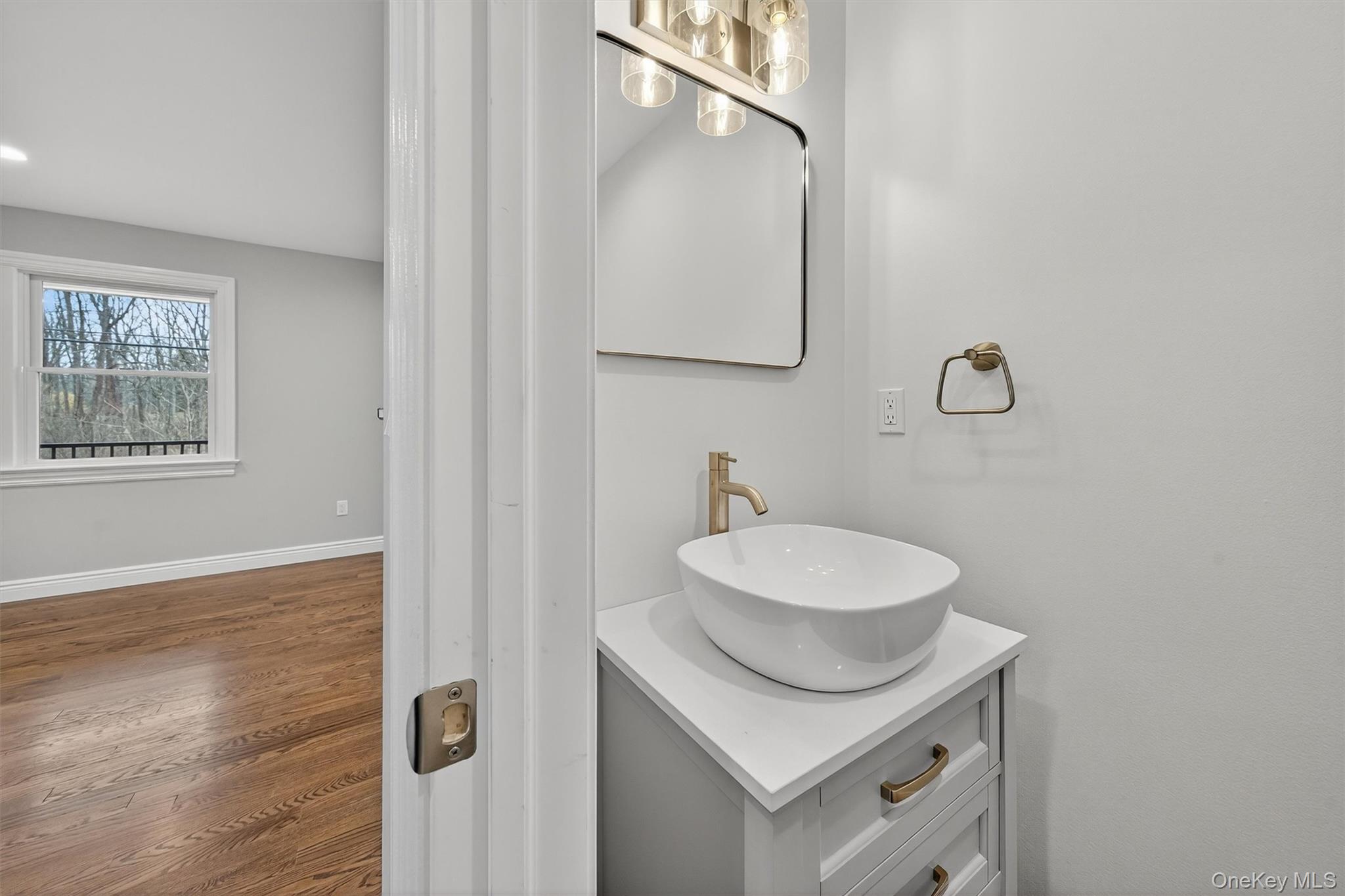 3 Little York Road Warwick, NY 10990 - Photo 19 of 39 a bathroom with a granite countertop sink and a mirror