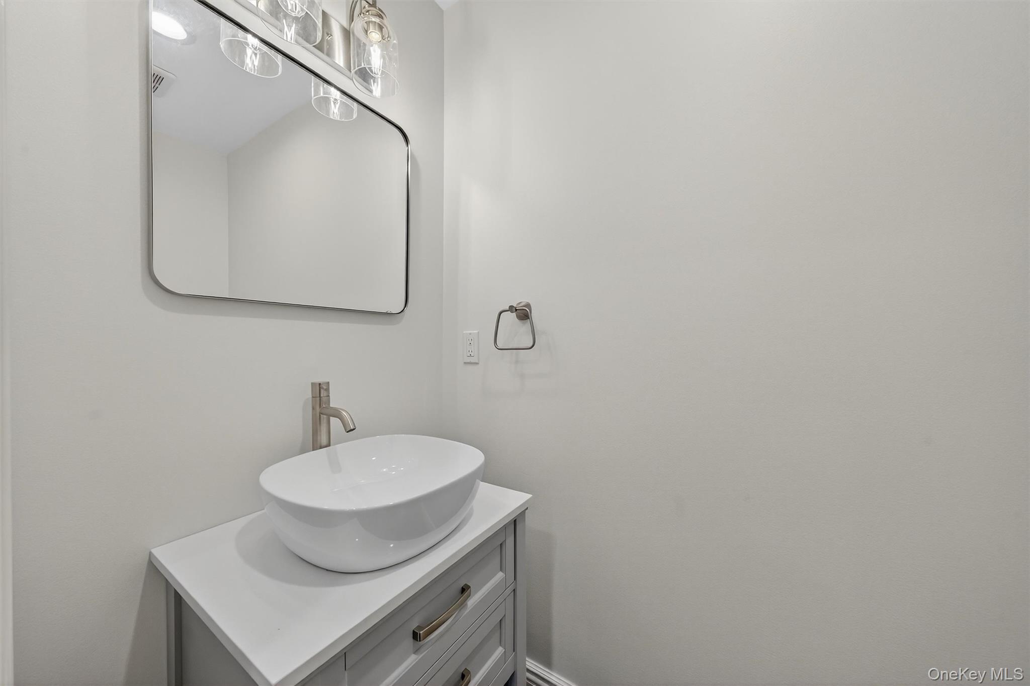 3 Little York Road Warwick, NY 10990 - Photo 20 of 39 a bathroom with a toilet sink and mirror