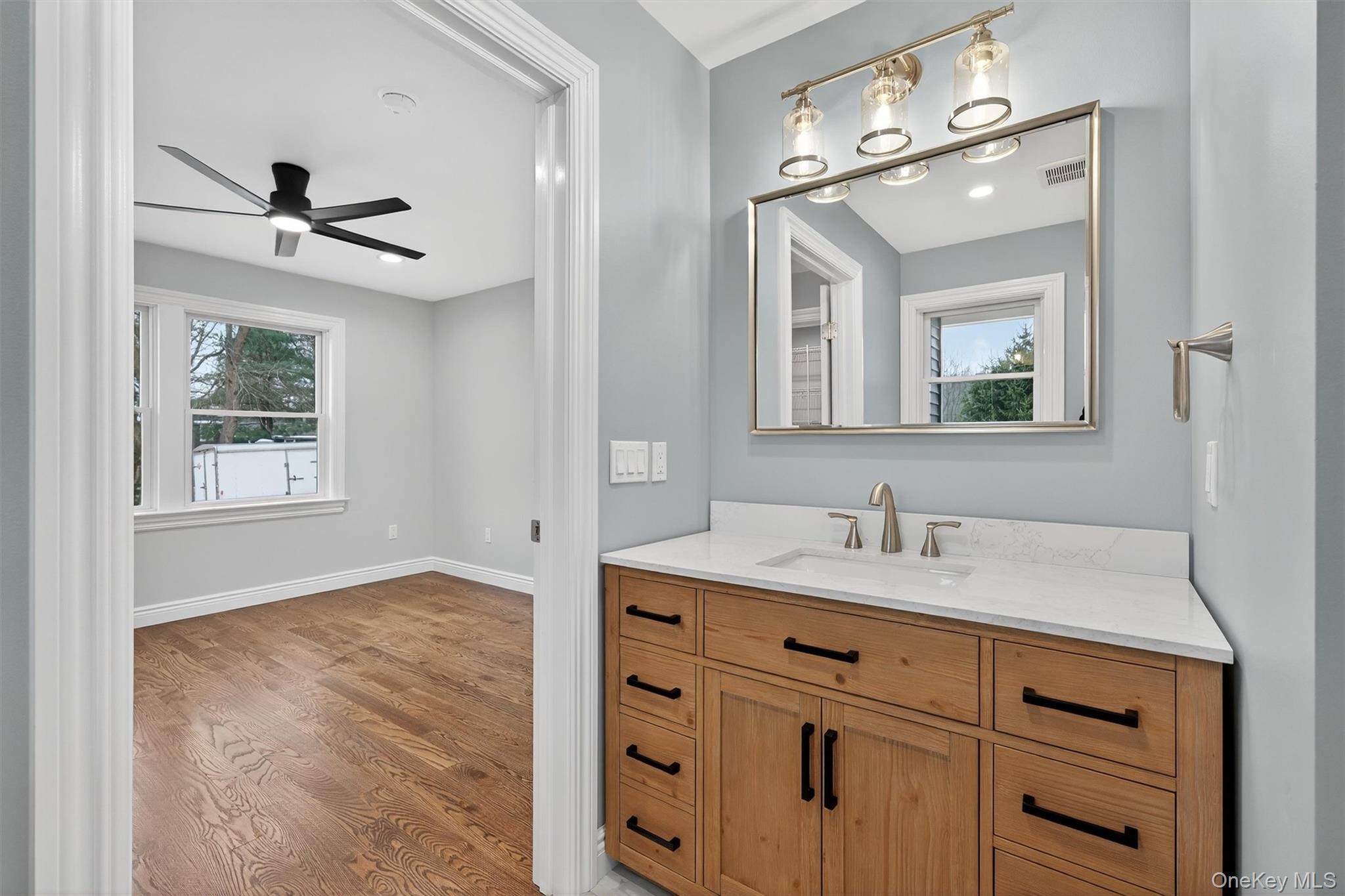 3 Little York Road Warwick, NY 10990 - Photo 24 of 39 a bathroom with a sink vanity and a mirror