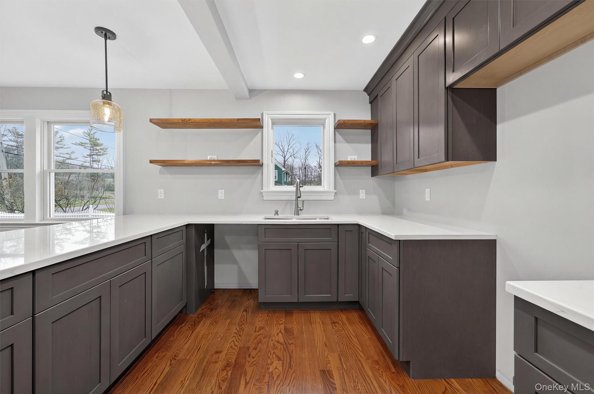 3 Little York Road Warwick, NY 10990 - Photo 8 of 39 a kitchen with kitchen island granite countertop a sink window and cabinets