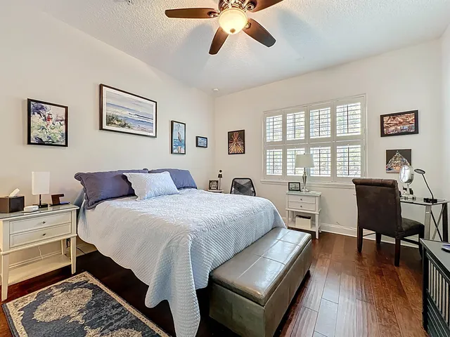 a bedroom with a bed and a table