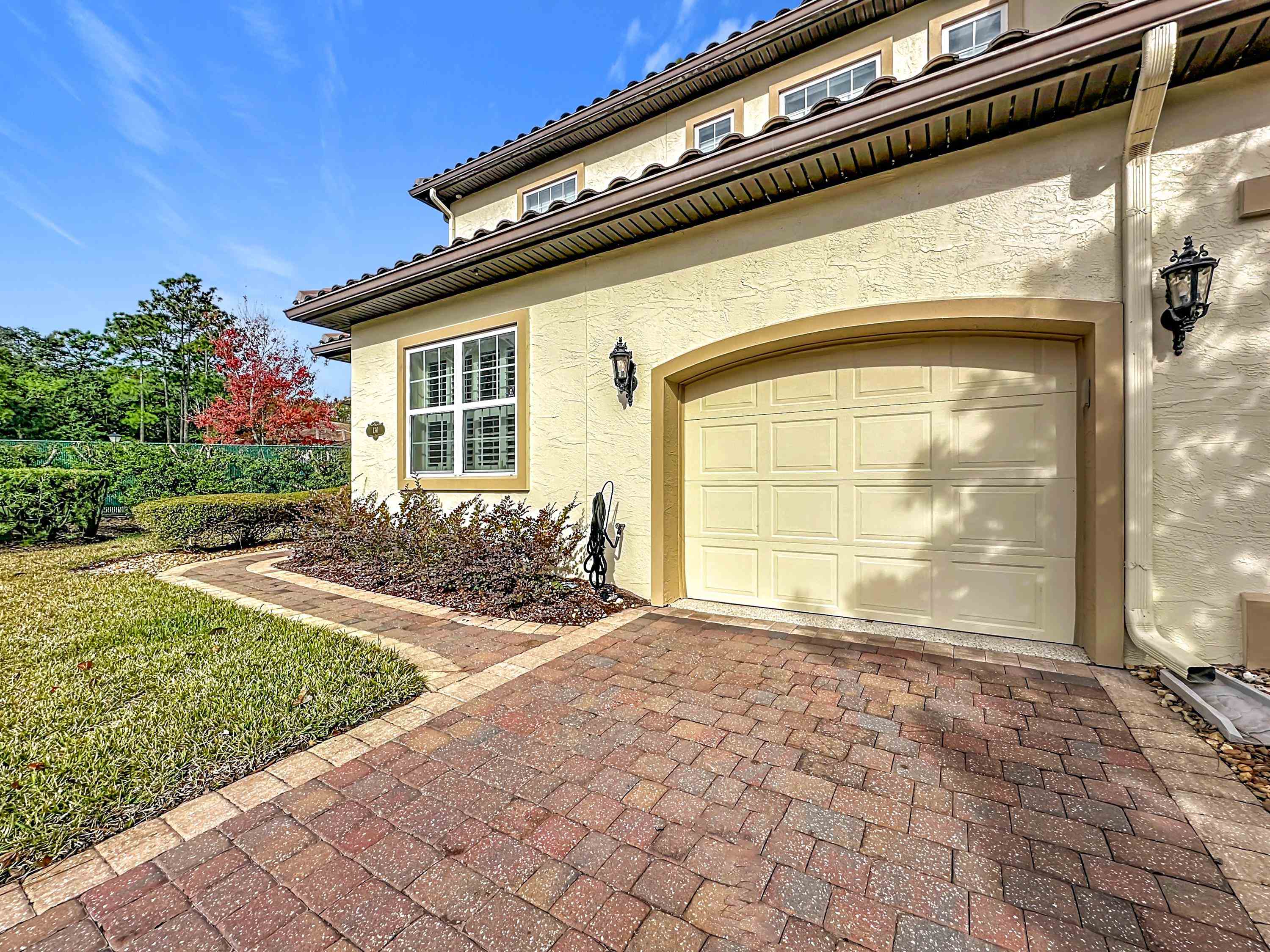 130 Grand Ravine Drive St. Augustine, FL 32086 - Photo 2 of 42 Garage featuring decorative driveway