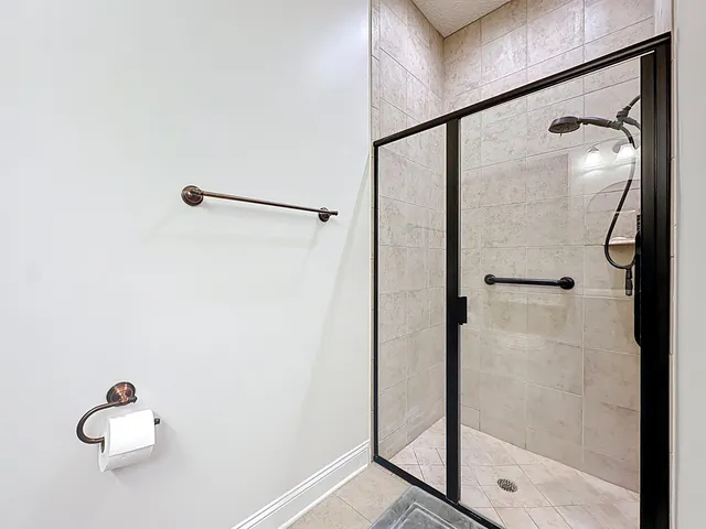 a bathroom with a toilet a sink and a mirror