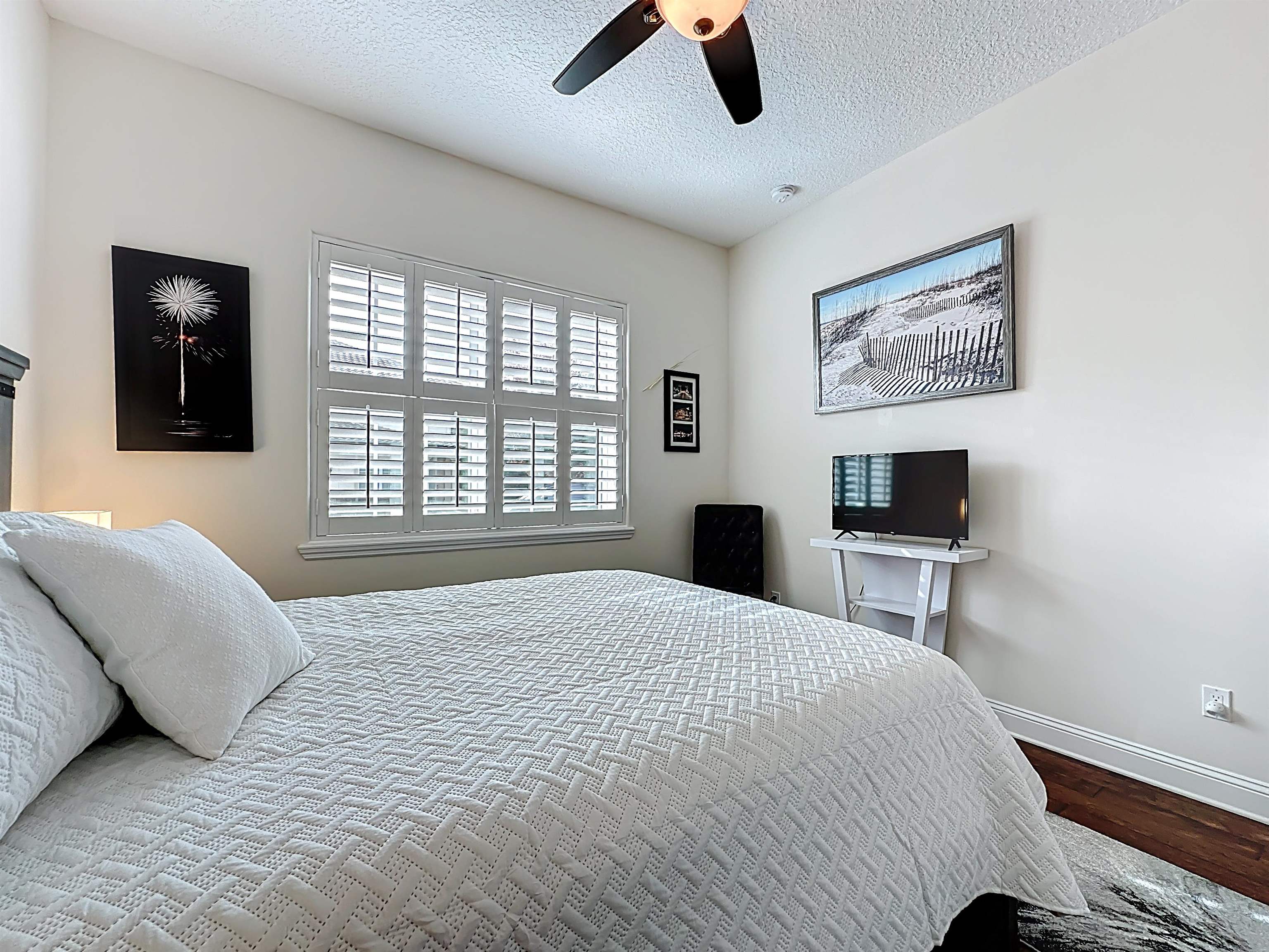 130 Grand Ravine Drive St. Augustine, FL 32086 - Photo 26 of 42 Bedroom with dark wood finished floors, a textured ceiling, and a ceiling fan