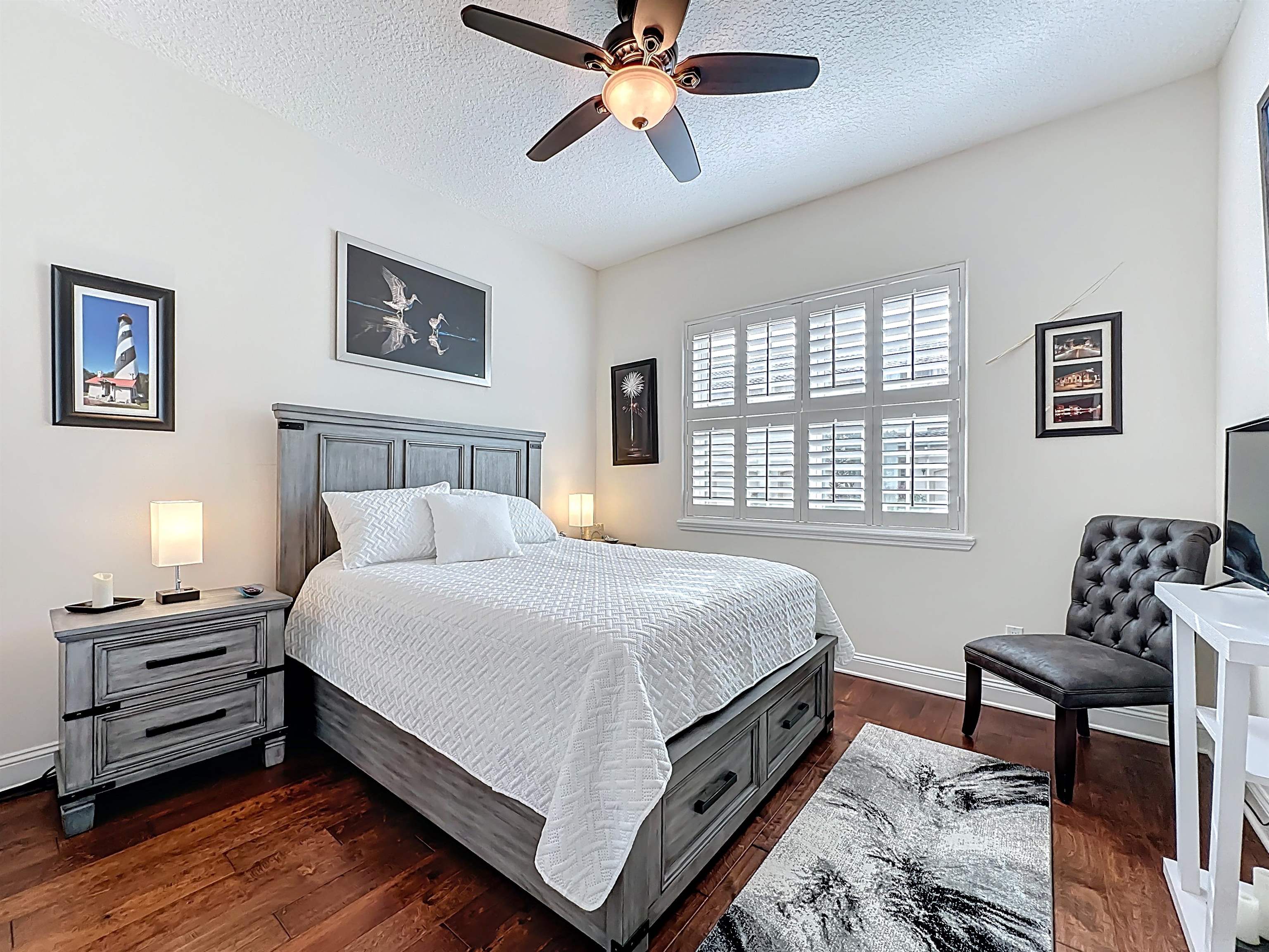 130 Grand Ravine Drive St. Augustine, FL 32086 - Photo 27 of 42 Bedroom with a textured ceiling, ceiling fan, and dark wood-style flooring