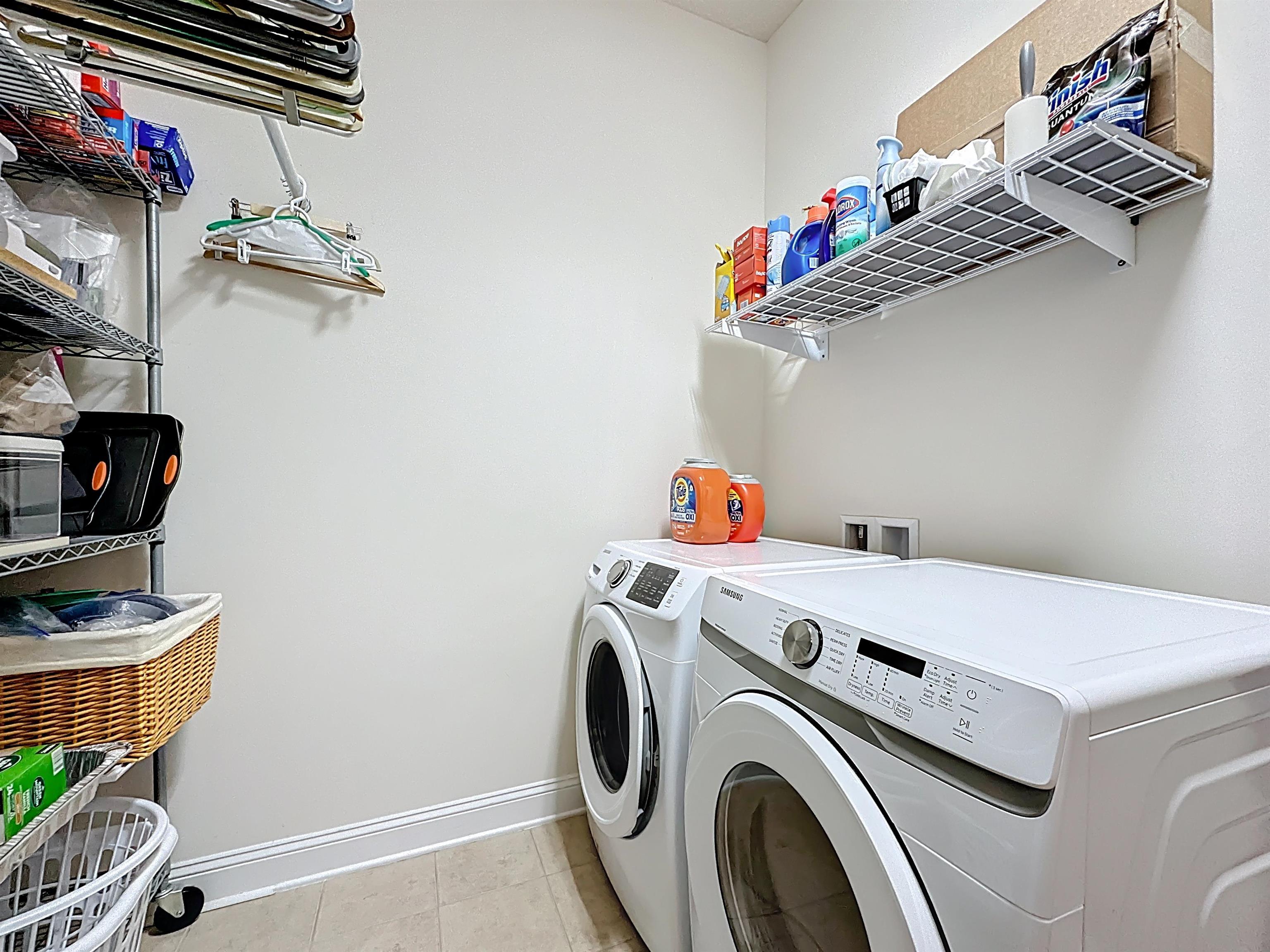 130 Grand Ravine Drive St. Augustine, FL 32086 - Photo 30 of 42 Laundry area featuring separate washer and dryer and light tile patterned flooring