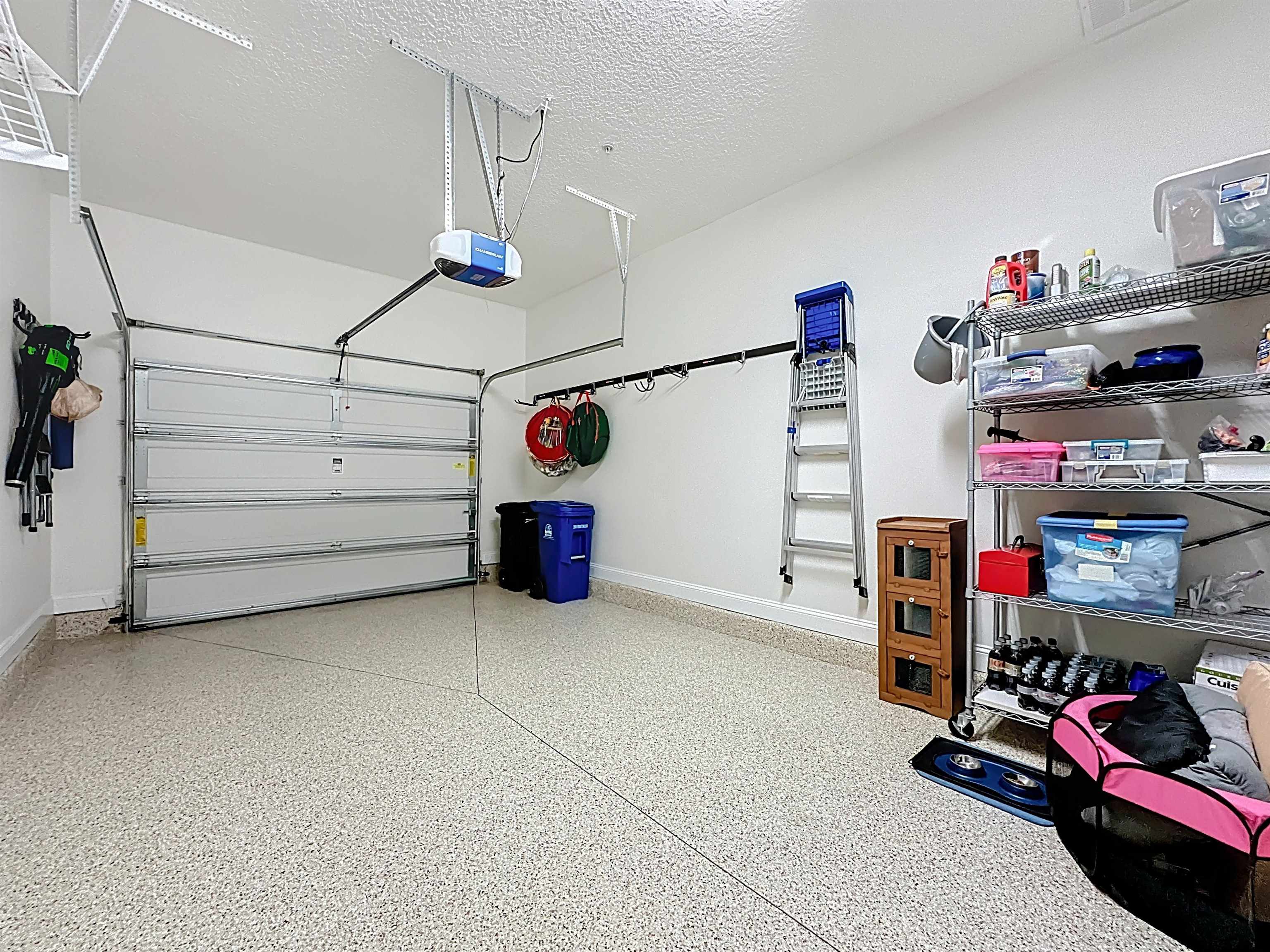 130 Grand Ravine Drive St. Augustine, FL 32086 - Photo 31 of 42 Garage with baseboards and a garage door opener