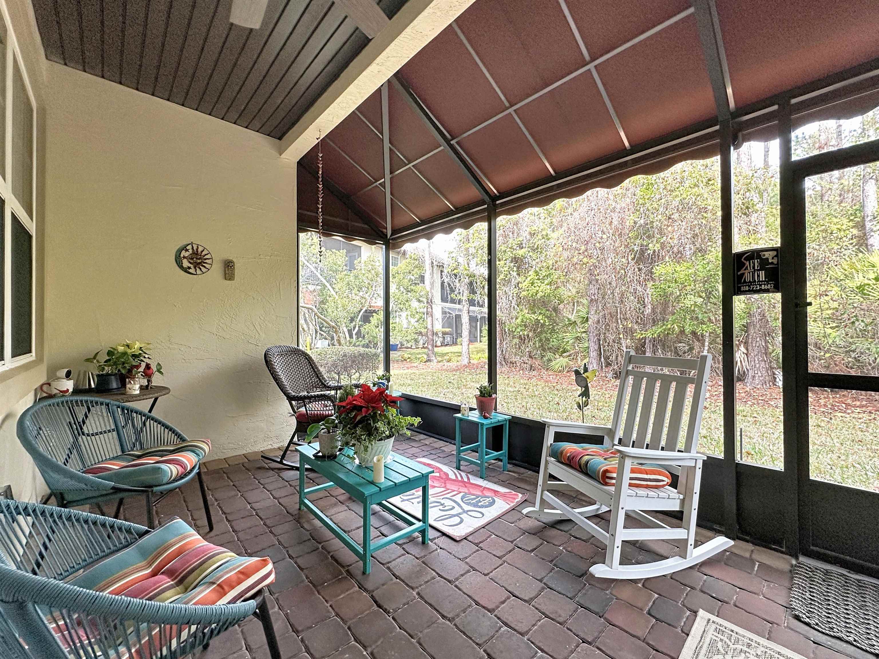 130 Grand Ravine Drive St. Augustine, FL 32086 - Photo 32 of 42 Sunroom / solarium featuring lofted ceiling and a patio area