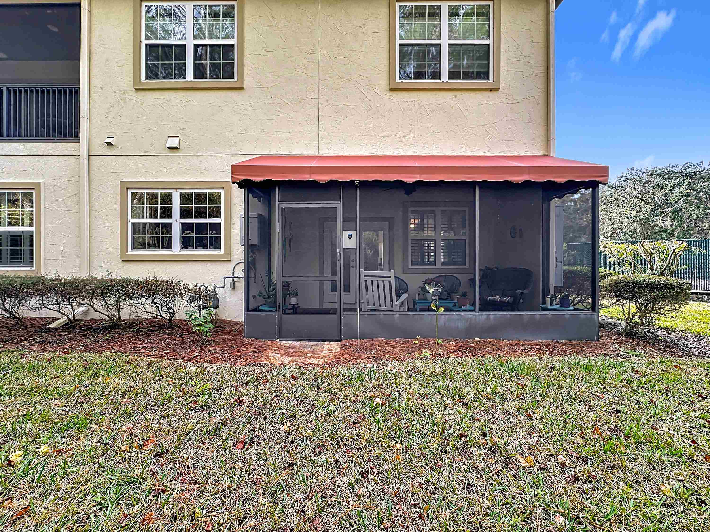 130 Grand Ravine Drive St. Augustine, FL 32086 - Photo 33 of 42 View of front of home featuring stucco siding and a sunroom
