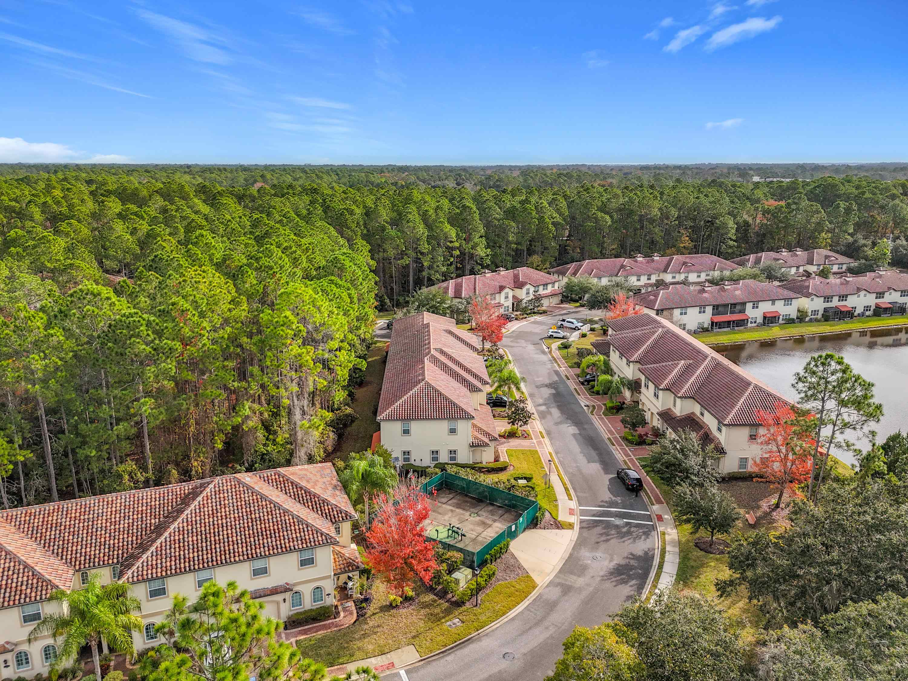 130 Grand Ravine Drive St. Augustine, FL 32086 - Photo 39 of 42 Aerial view of residential area with a heavily wooded area and a nearby body of water