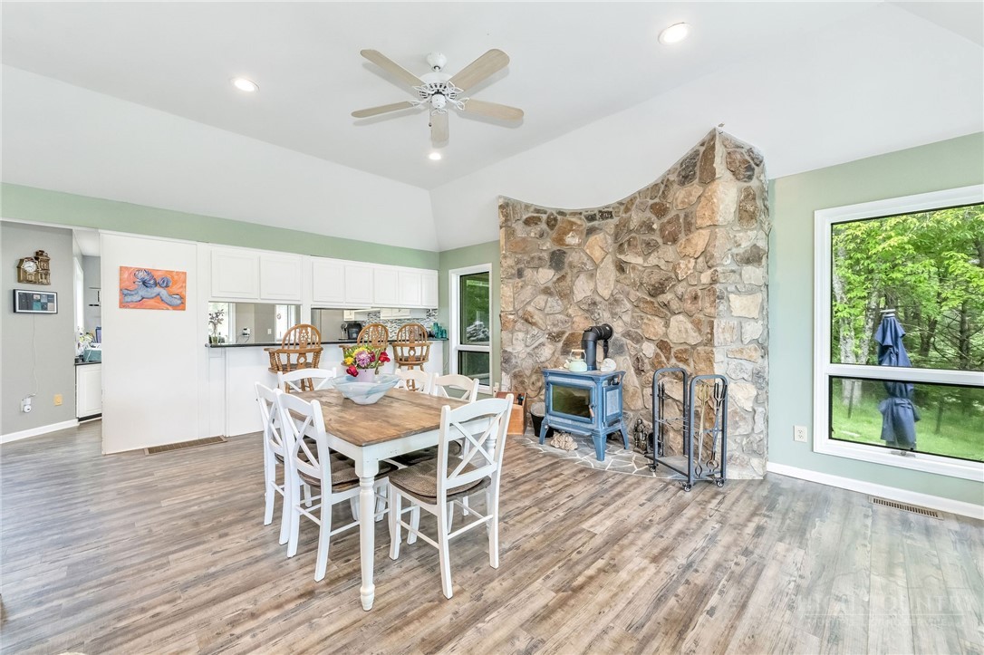 939 Don Bare Road Jefferson, NC 28640 - Photo 10 of 49 a view of a dining room with furniture window and wooden floor