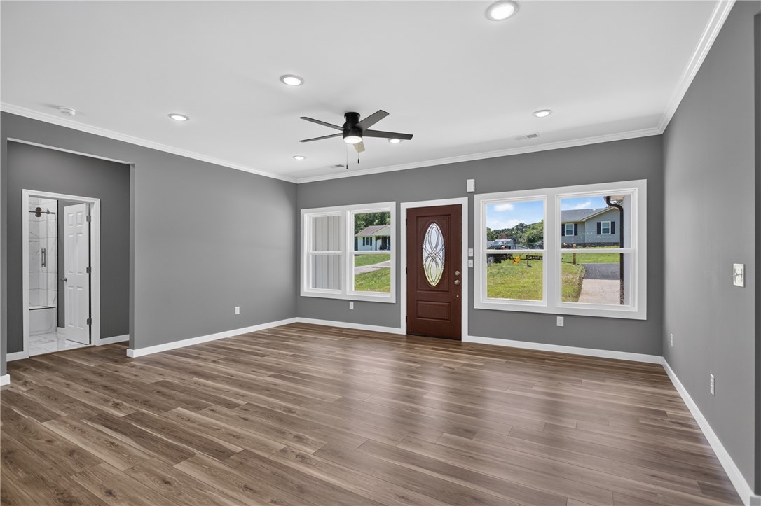 223 Maple Drive Anderson, SC 29621 - Photo 4 of 45 A welcoming front entry with ample natural light, smooth wood-tone flooring, and recessed ceiling lights.