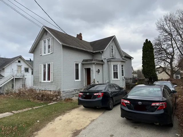 a car parked in front of a house