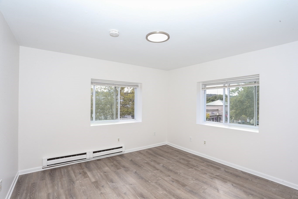 461 Washington Street, Unit 301 Boston, MA 02135 - Photo 7 of 13 an empty room with a window
