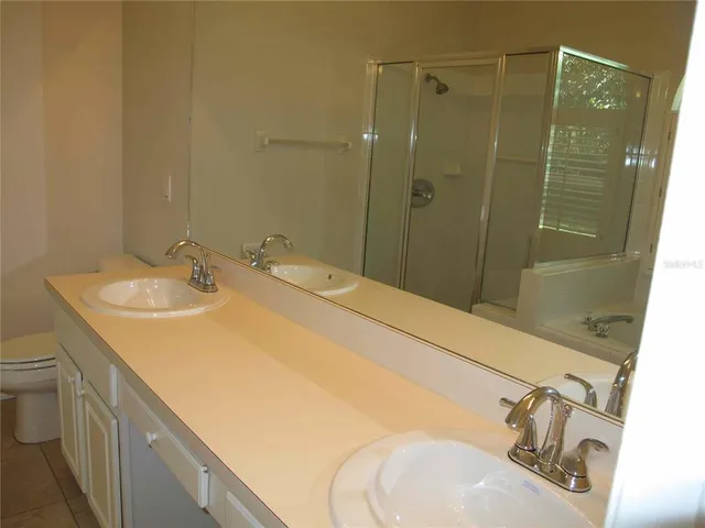 a bathroom with a sink and mirror
