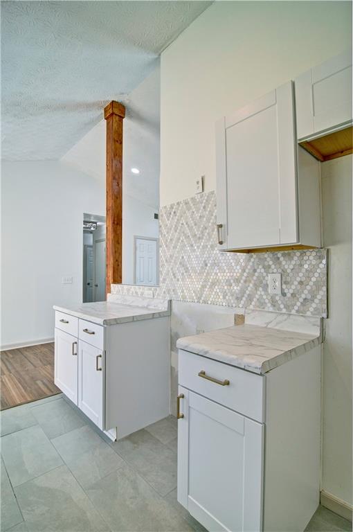 2665 Ivydale Court Southwest Atlanta, GA 30311 - Photo 20 of 45 a bathroom with a granite countertop sink and a mirror